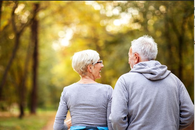 Elderly couple jog backside